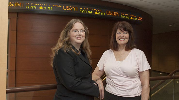 Image of Patricia Sobczak and Bettina Peacemaker in atrium of Snead Hall, School of Business