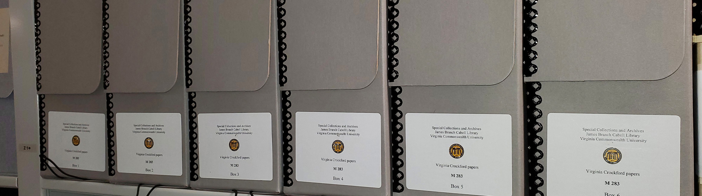 A close up of the grey boxes that VCU Libraries keeps the special collection manuscripts in.