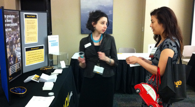 Antonia Vassar with a new VCU Graduate at the Passport to the World Fair, May 2013.