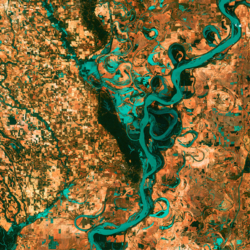 an image of river system in satellite view with dry land all around it