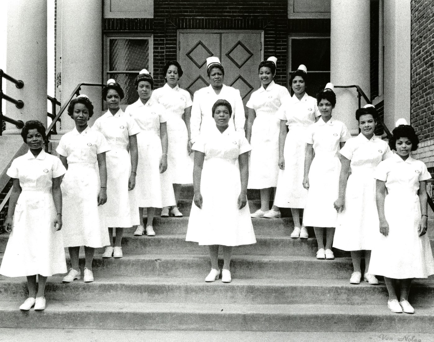 Black and white image of graduating students, circa 1960
