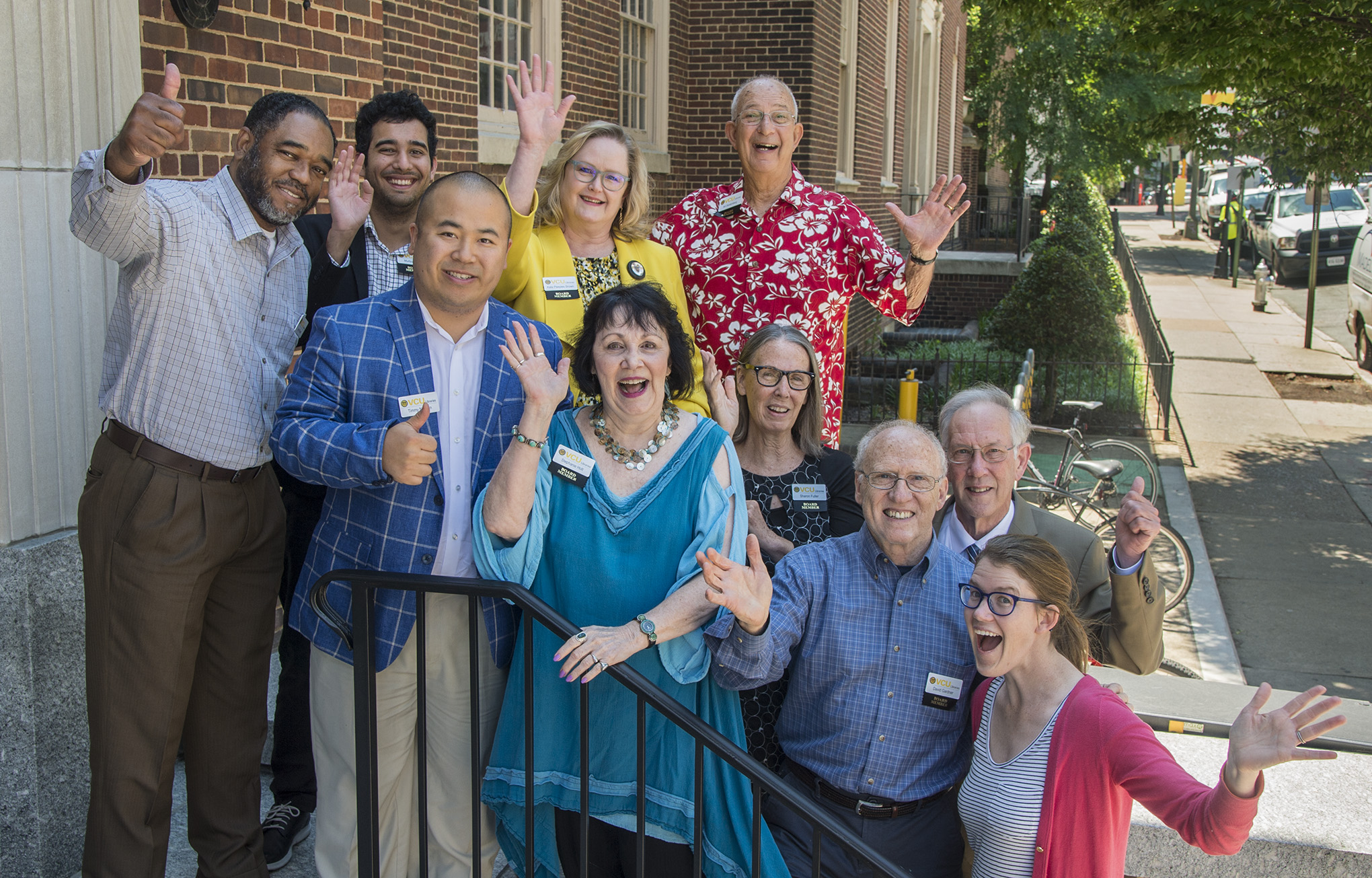 A picture of the Friends of VCU Libraries outside smiling and waving.